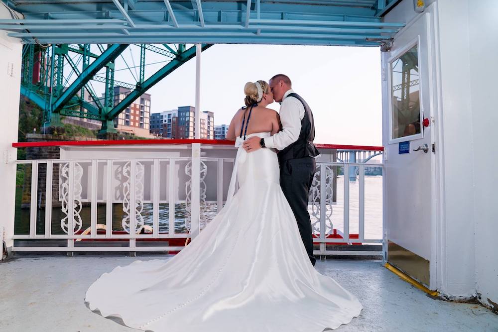 Brad and Rachel Cheek celebrating their wedding reception on the Star of Knoxville