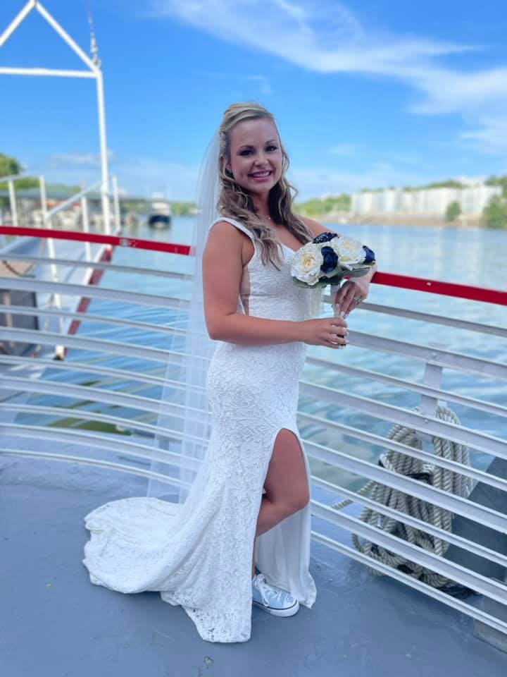 Wider shot of bride on the bow of Star of Knoxville