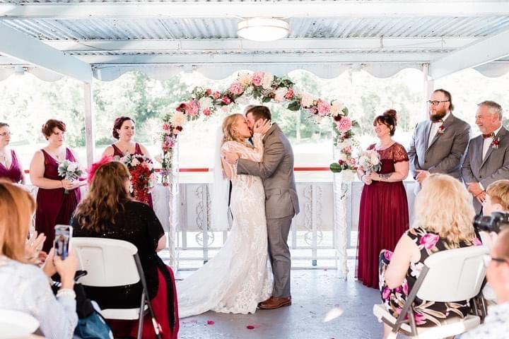 Bride and groom kissing for first time on the Star of Knoxville